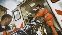 Paramedic team pushing stretcher
